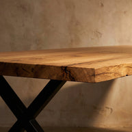 Stylized close-up of the table edge with dramatic lighting, focusing on thickness, epoxy fill, and natural oak character.